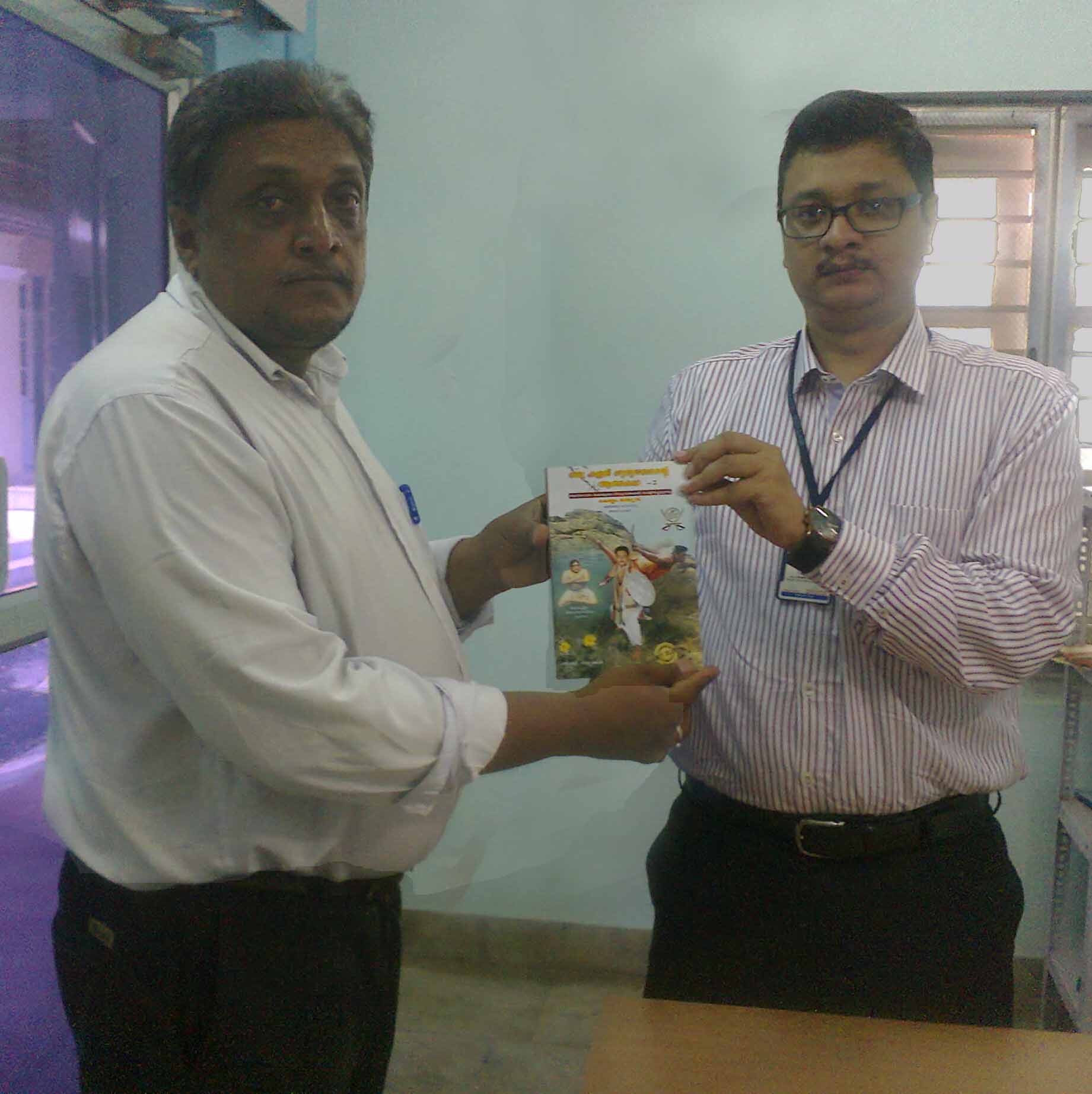 Mathew gurukkal giving 1st copy to District Collecor