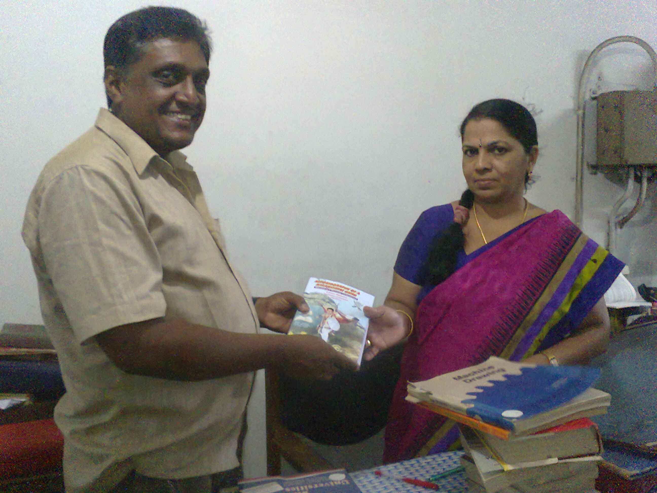 Mathew gurukkal giving copy to librarian Asha,katcheri Jn,Kollam